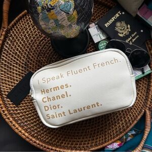 LA Trading Co. “I Speak Fluent French” Cream Sling Belt Bag New with Tags